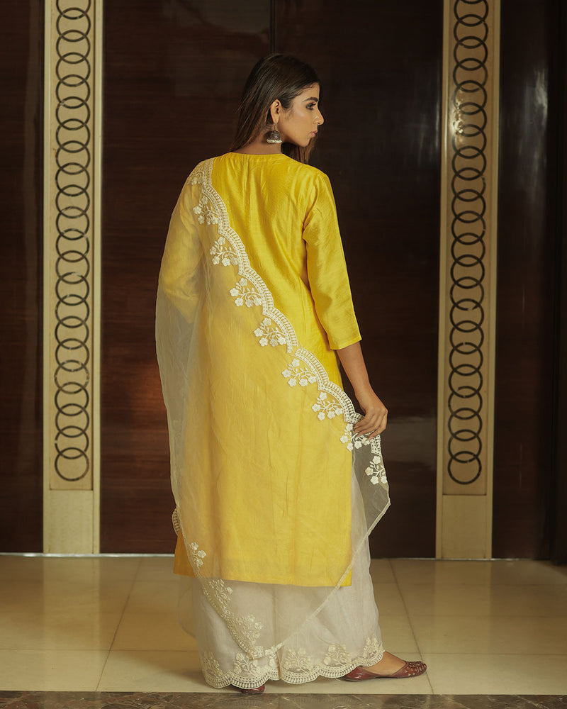 Bright yellow silk cotton Anarkali features polka dots, embroidered neck  work & contrast dupatta with intricate designs
